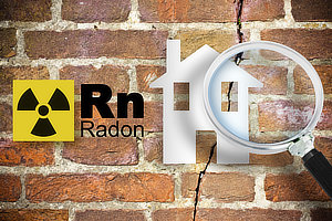 The danger of radon gas in our homes - concept with periodic table of the elements, radioactive warning symbol and home silhouette seen through a magnifying glass against a cracked brick wal